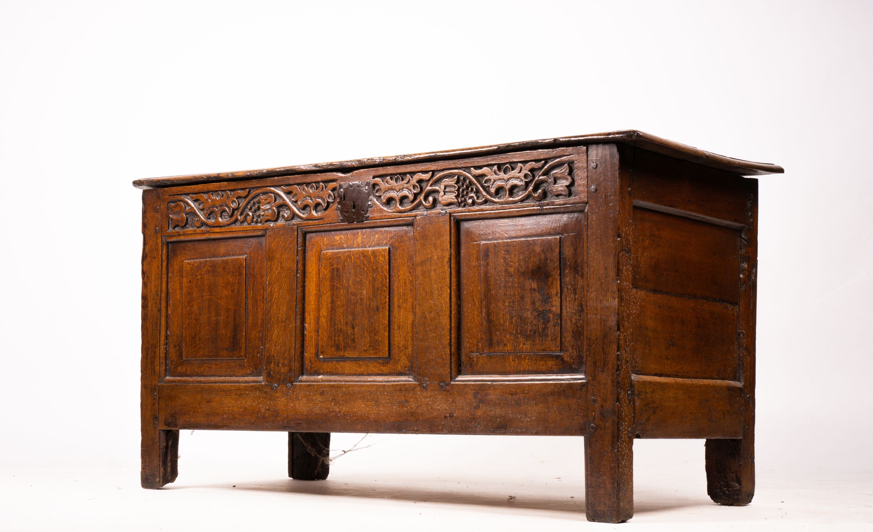 A 17th / 18th century carved oak coffer, length 132cm, depth 53cm, height 64cm